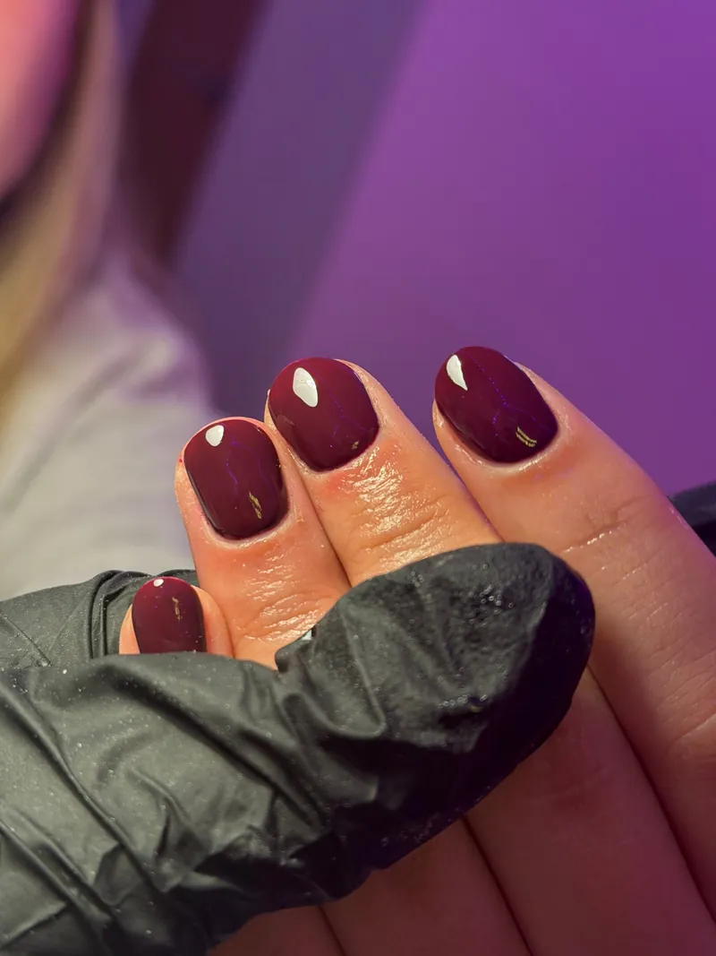 Glossy burgundy short nails, by Rosie Mae Beauty